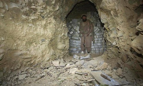 39787386_An-Afghan-mujahadeen-guards-one-of-the-caves-in-the-captured-Al-Qae.jpg